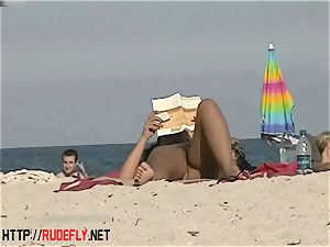 super-steamy honeys filmed lounging on a naturist beach