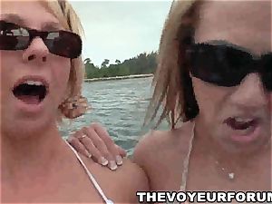 amateur lesbian bikini honeys have a playful intercourse on a boat